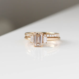 Emerald cut champagne diamond ring with diamond pave band