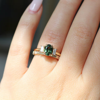 Claire White Lab Diamond Band stacked with green sapphire ring on hand in sunlight