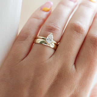 Classic Medium Band stacked with pear diamond ring on hand 