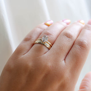 Classic Medium Band stacked with oval diamond ring on hand 