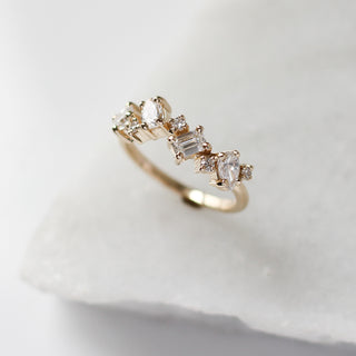 Custom wedding band with ethically sourced diamond stones in a gold setting, handcrafted by Yuliya Chorna at her Toronto studio.