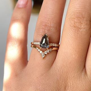 Shield Cut Salt And Pepper Diamond Ring with crown diamond band on hand in sunlight