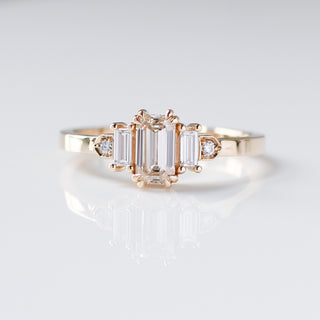 Custom engagement ring with ethically sourced diamond centre stone in a gold setting, handcrafted by Yuliya Chorna at her Toronto studio.