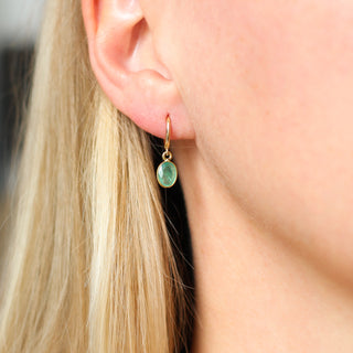 Green Emerald Bezel Drop Hoop Earrings being worn front view