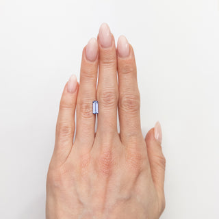 Emerald cut blue sapphire on hand