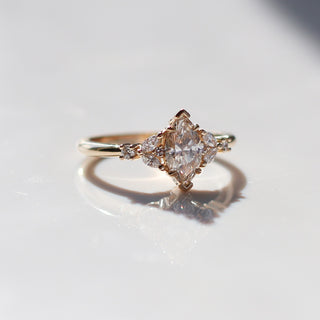 Folia Marquise Cut Champagne Diamond Ring quarter side view with reflections in sunlight
