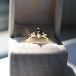Teal Kite Sapphire Ring in jewellery box side view in sunlight