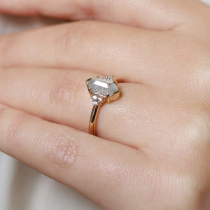 Hexagon diamond engagement ring close up on hand