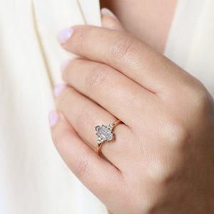 Hexagon diamond engagement ring on hand