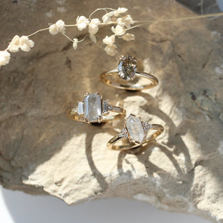 Hexagon diamond engagement ring on stone group shot