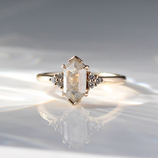 Hexagon diamond engagement ring with diamond cluster accents