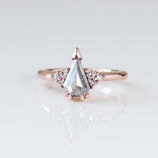 Custom glacier engagement ring with ethically sourced diamond centre stone in a rose gold setting, handcrafted by Yuliya Chorna at her Toronto studio.