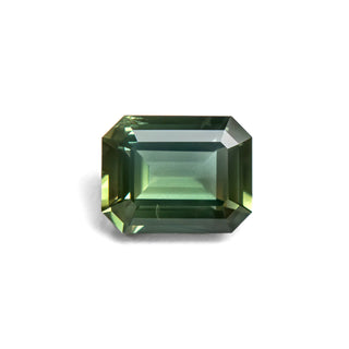 Green emerald cut sapphire on white background