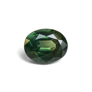 Green oval cut sapphire on white background