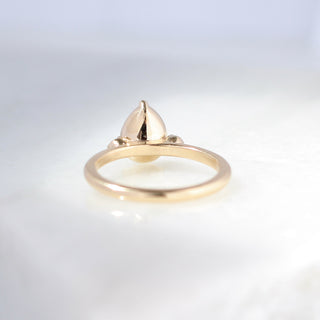 Pear cut green sapphire engagement ring back view