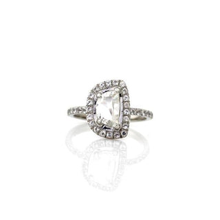 Custom halo engagement ring with ethically sourced diamond centre stone in a platinum setting, handcrafted by Yuliya Chorna at her Toronto studio.