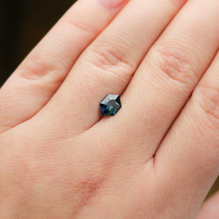 Hexagon shaped teal sapphire on hand