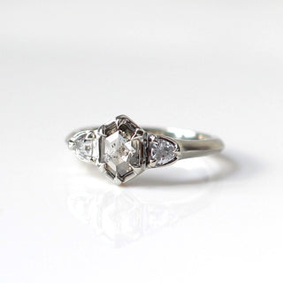 Custom engagement ring with ethically sourced hexagon diamond centre stone in a white gold setting, handcrafted by Yuliya Chorna at her Toronto studio.