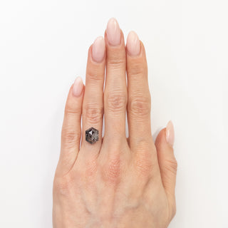 Hexagon salt and pepper diamond on finger