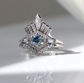 Custom pointed wedding band and engagement ring set with ethically sourced gemstones in a white gold setting, handcrafted by Yuliya Chorna at her Toronto studio.