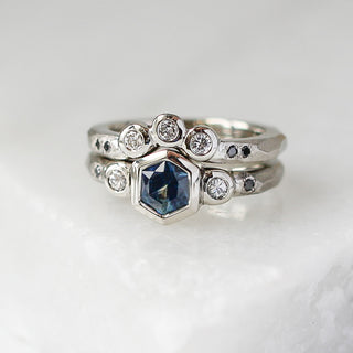 Custom wedding band and engagement ring set with ethically sourced gemstones in a white gold setting, handcrafted by Yuliya Chorna at her Toronto studio.