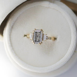 Emerald cut diamond ring in yellow gold in jewelery box