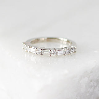 Custom wedding band with ethically sourced diamonds in a white gold setting, handcrafted by Yuliya Chorna at her Toronto studio.