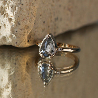 Custom teardrop engagement ring with ethically sourced centre stone in a gold setting, handcrafted by Yuliya Chorna at her Toronto studio.