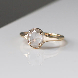 Custom engagement ring with ethically sourced diamond centre stone in a gold setting, handcrafted by Yuliya Chorna at her Toronto studio.