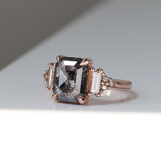 Custom engagement ring with ethically sourced black diamond centre stone in a rose gold setting, handcrafted by Yuliya Chorna at her Toronto studio.