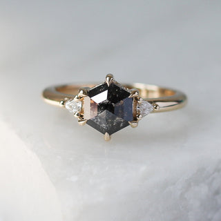 Custom engagement ring with ethically sourced black diamond centre stone in a gold setting, handcrafted by Yuliya Chorna at her Toronto studio.