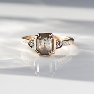 Rectangular cut diamond ring in yellow gold with reflection front detail view