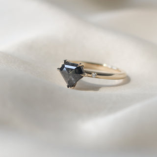 Custom engagement ring with ethically sourced black diamond centre stone in a gold setting, handcrafted by Yuliya Chorna at her Toronto studio.