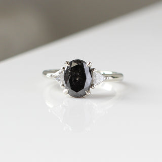 Custom engagement ring with ethically sourced black diamond centre stone in a silver setting, handcrafted by Yuliya Chorna at her Toronto studio.