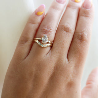 Large Diamond Wave Band stacked with Oval Diamond ring on hand 