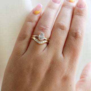 Large Diamond Wave Band stacked with Oval Diamond ring on hand 