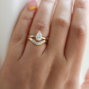 Large Diamond Wave Band with Pear Diamond  ring on hand 