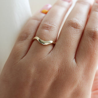 Large Wave Gold Wedding Band on hand 