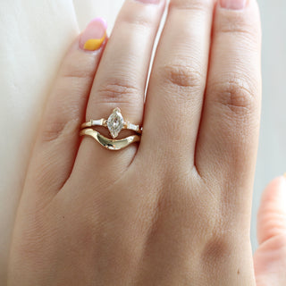 Large Wave Gold Wedding Band stacked with oval Diamond ring on hand 