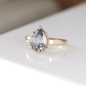 Pear pale blue sapphire engagement ring three quarter view