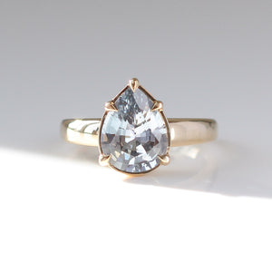 Pear pale blue sapphire engagement ring in sunlight