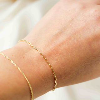 thin paper clip chain bracelet close up on hand