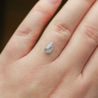 Pear shaped salt and pepper diamond on hand