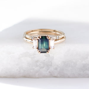 five diamond wedding band and emerald cut green sapphire ring set