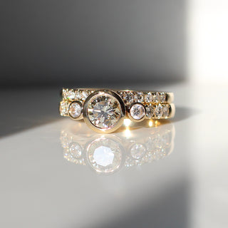 Custom point wedding band and engagement ring with ethically sourced diamonds in a gold setting, handcrafted by Yuliya Chorna at her Toronto studio.