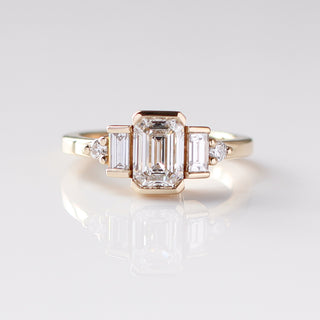 Custom engagement ring with ethically sourced diamond centre stone in a gold setting, handcrafted by Yuliya Chorna at her Toronto studio.