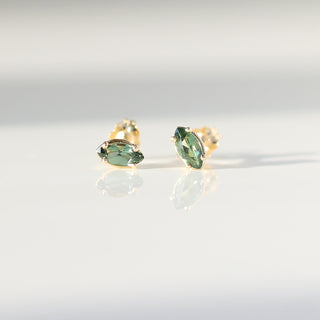 Marquise cut green sapphire earrings in solid gold front view with reflections 