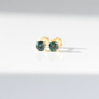 Round Green Sapphire Studs in sunlight front view
