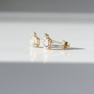 oval cut sapphire earrings in sunlight side view