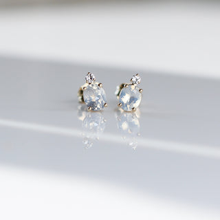 oval cut sapphire earrings accented by a round cut sapphire front view